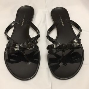Black studded sandals with rock stud bow